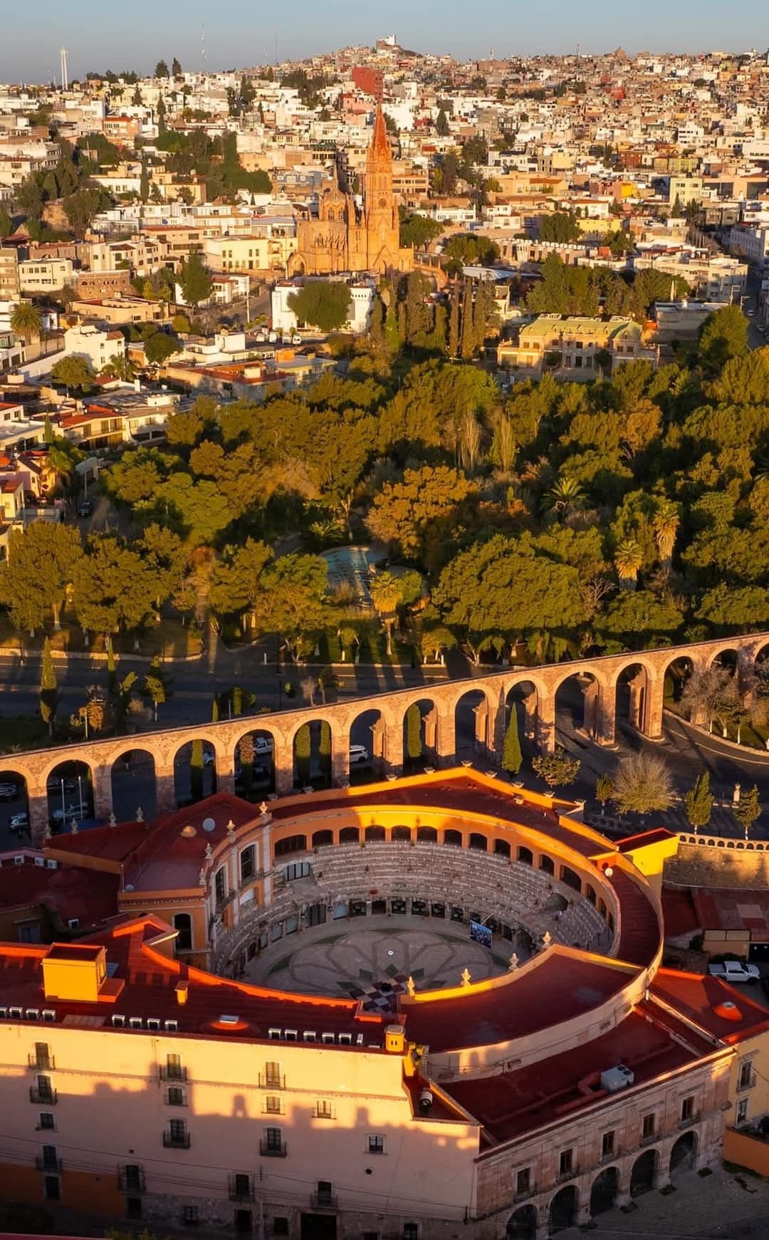 Aerial view of Zacatecas at golden hour with the aqueduct